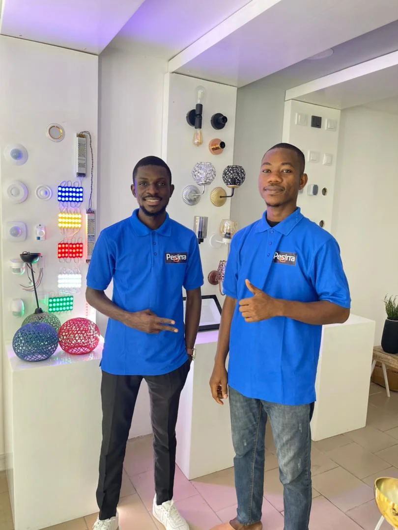 Bathroom Vanity Pesina team at Abidjan lighting store and showroom with LED wall display, CE-compliant light fixtures